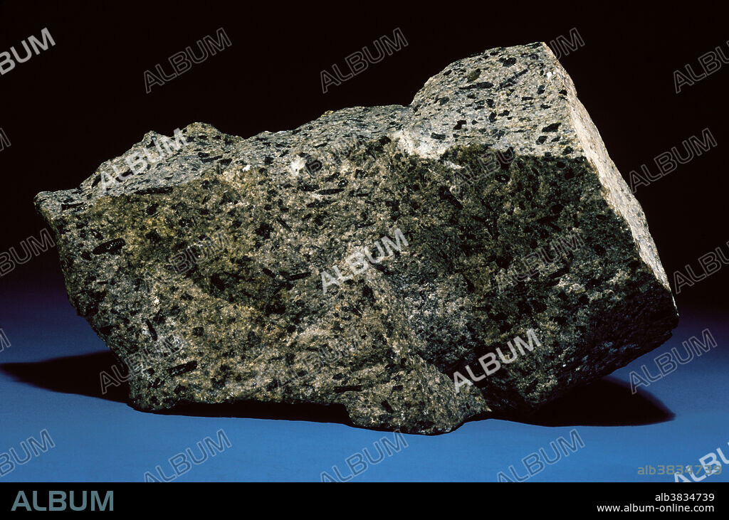 Andesites are igneous rocks composed mainly of plagioclase feldspar (such as andesite or oligoclase) and various other dark minerals, such as biotite, hornblende or pyroxene. Multiple stages of cooling allow the formation of larger crystals (slow cooling) within a finer-grained 'groundmass' (more rapid cooling).