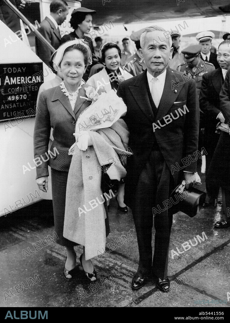 Thai Premier on Official Visit -- Field Marshal Pibul Songgram, Prime Minister of Thailand, and his wife, Tan Poo-Ying La-Iad Pibul Songgram, arrive at London Airport to-day (Tuesday) on an official visit to the United Kingdom, which is part of the World tour he is currently making. The 58-year-old Premier, who was a leader the bloodless revolution in his country in 1932 held office under the Japanese and led ***** into the last war on their side. He resigned when the Japanese faced defeat, but returned to power in 1947 - a convert to democracy. June 7, 1955. (Photo by Reuterphoto).