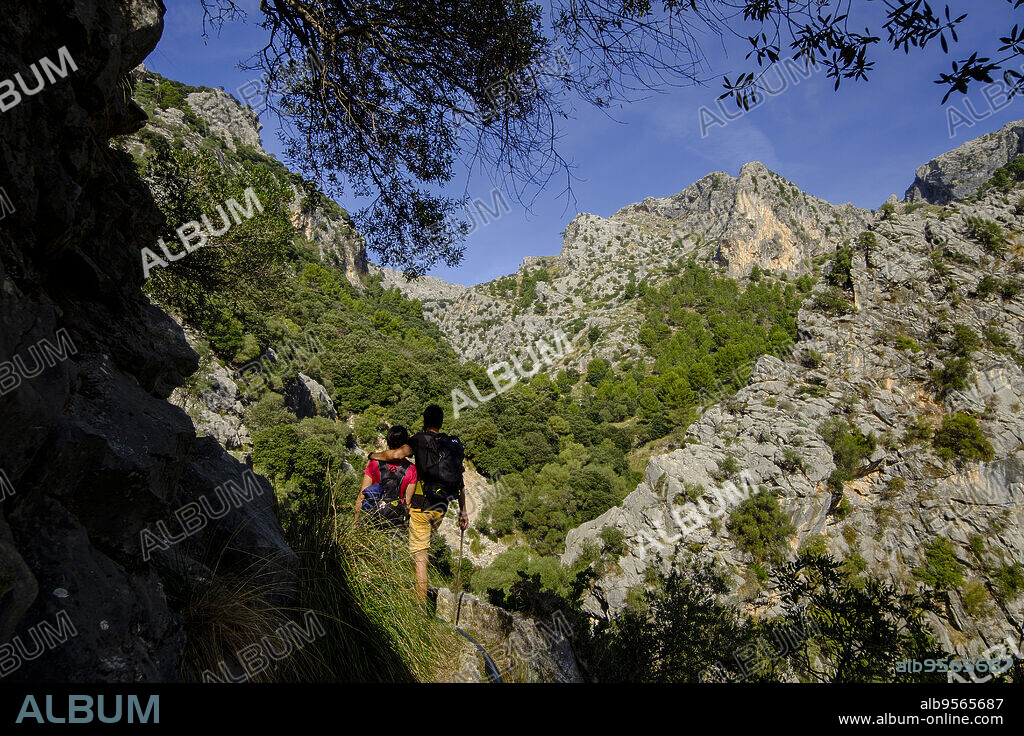couple walking on the path,Solleric canal,torrent d'Almadrà, Alaró, , 18th century,Majorca, Balearic Islands, Spain.