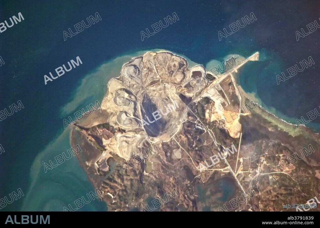 View from space of the Panian Coalfield, an open-pit coal mine on the northern end of Semirara Island, in the Philippines.