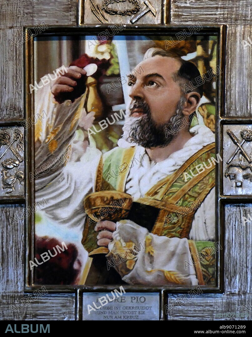 Photograph of an icon of Padre Pio, also known as Saint Pio, inside of St. Stephen's Cathedral, (Stephansdom), in Vienna which dates from the 12th to 15th centuries. Padre Pio (1887-1968) a friar, priest, stigmatist, and mystic, now venerated as a Saint of the Catholic Church. Dated 21st Century.