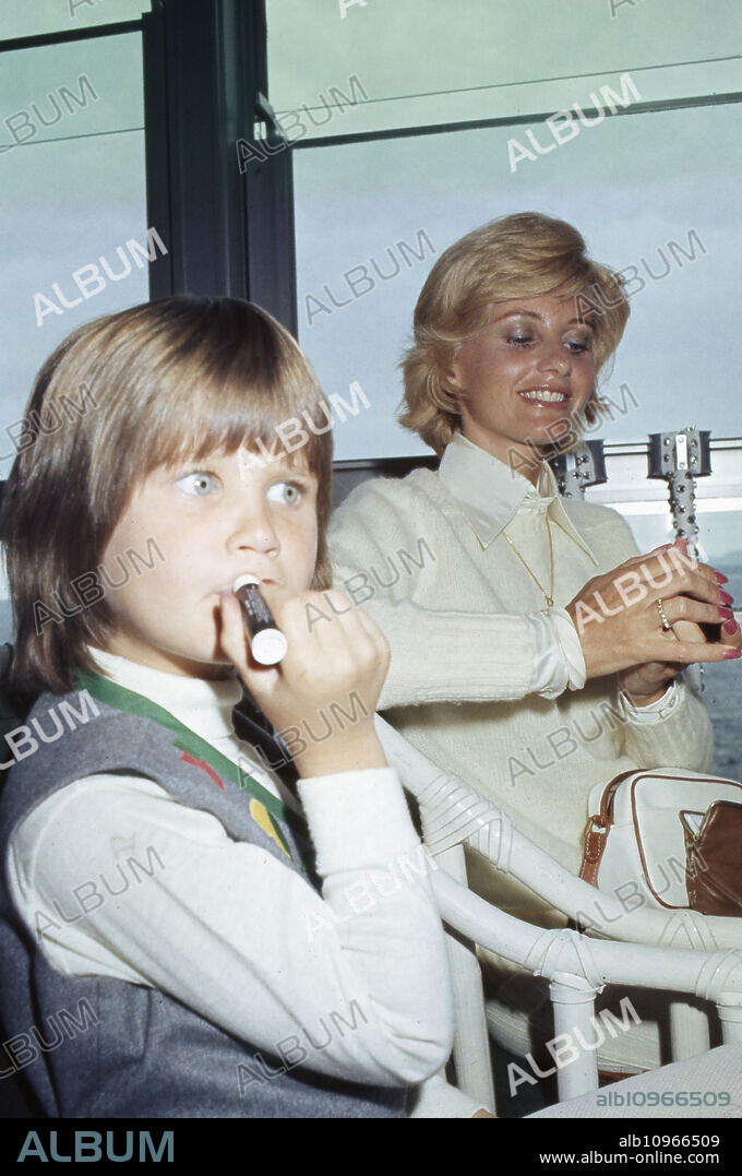 Charles Bronson's wife Jill Ireland with daughter Zuleika Bronson at a restaurant, France 1970s.