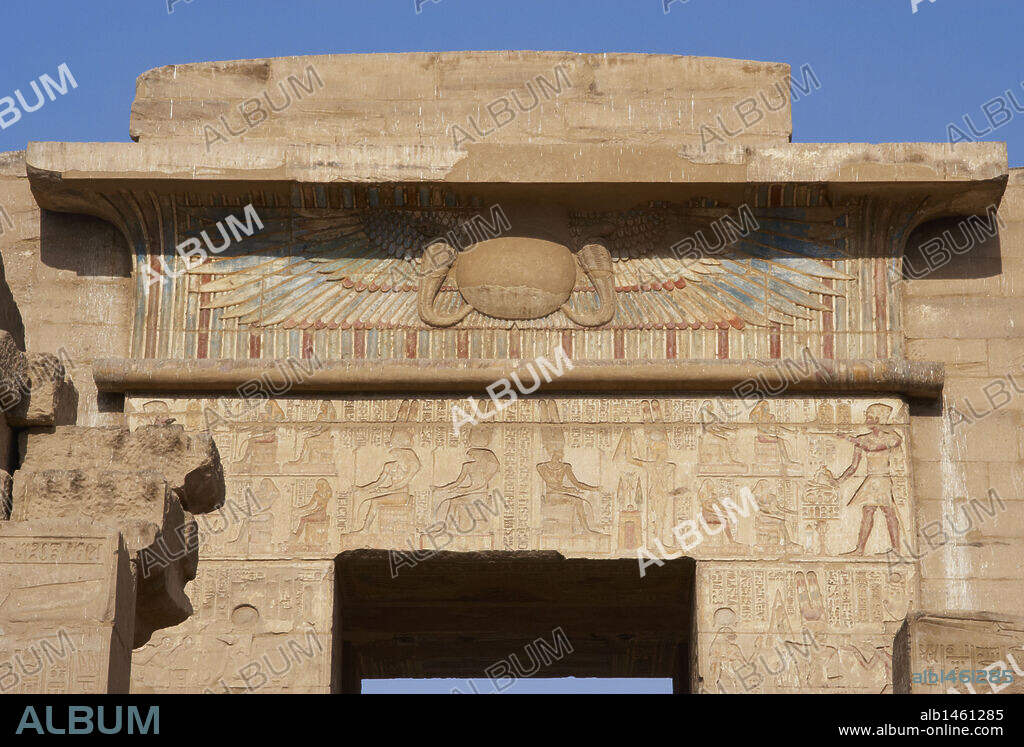 Temple of Ramses III. Winged sun relief (falcon wings with two uraeus and solar disk), as a symbol of protection above the doors of the temples. New Kingdom. (1550-1069 b.C). Twentieth dynasty. Thebes. Medinet-Habou. Egypt.