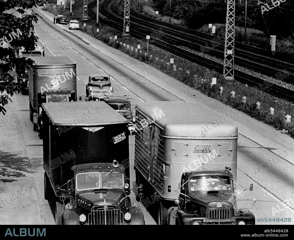 Lancaster Turnpike, truck-filled outside Philadelphia, has four lanes paralleling four empty mainline tracks of the Pennsylvania Railroad. Rail highways are wasted while motor highways are clogged. December 04, 1953. (Photo by Look Magazine).