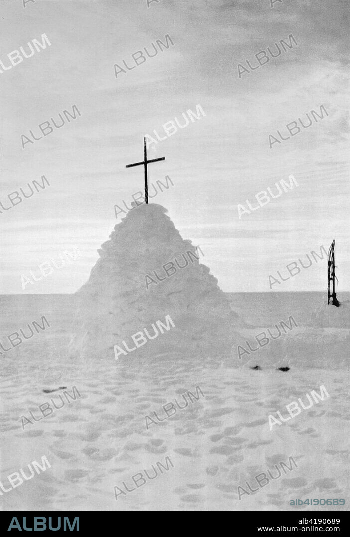 'The Last Rest (The Grave of Scott, Wilson and Bowers)', November 1912, (1913). A snow cairn with cross on top marks the tent in which expedition leader Captain Robert Scott, Lieutenant Henry Bowers and Dr Edward Wilson died. The final expedition of British Antarctic explorer Captain Robert Falcon Scott (1868-1912) left London on 1 June 1910 bound for the South Pole. The Terra Nova Expedition, officially the British Antarctic Expedition (1910-1913), included a geologist, a zoologist, a surgeon, a photographer, an engineer, a ski expert, a meteorologist and a physicist among others. Scott wished to continue the scientific work that he had begun when leading the Discovery Expedition to the Antarctic in 1901-04. He also wanted to be the first to reach the geographic South Pole. Scott, accompanied by Dr Edward Wilson, Captain Lawrence Oates, Lieutenant Henry Bowers and Petty Officer Edgar Evans, reached the Pole on 17 January 1912, only to find that the Norwegian expedition under Amundsen had beaten them to their objective by a month. Delayed by blizzards, and running out of supplies, Scott and the remainder of his team died at the end of March. Their bodies and diaries were found eight months later. From Scott's Last Expedition, Volume II. [Smith, Elder & Co., London, 1913].