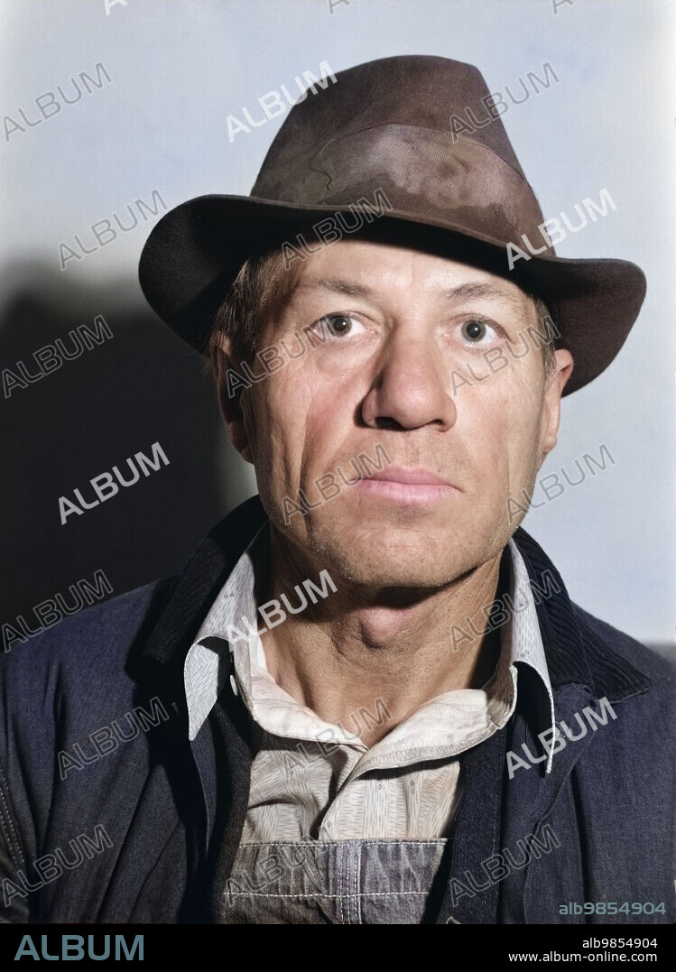 Unemployed coal miner, head and shoulders portrait, Herrin, Illinois, USA, Arthur Rothstein, U.S. Farm Security Administration, colorized, January 1939.