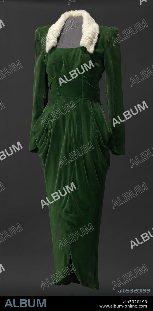 A green velvet dress worn by Lena Horne in the film Stormy Weather (1943). The dress has a gathered waist, buckle-back, and ermine collar. It was worn by Horne as "Selina Rogers" in the dressing-room scene with actor Bill Robinson.