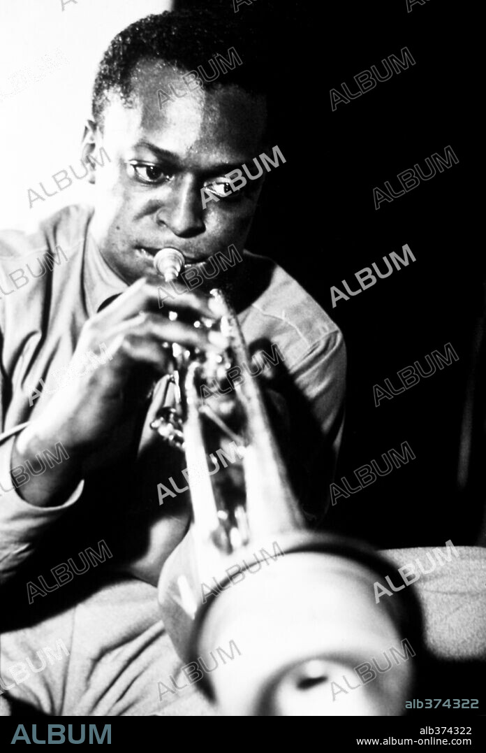 Miles Davis playing trumpet.