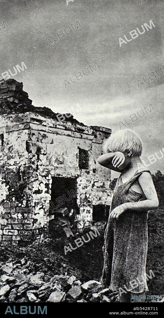 USSR June 1941. An orphan at the ruins after the bombing. Russia. World War Two.