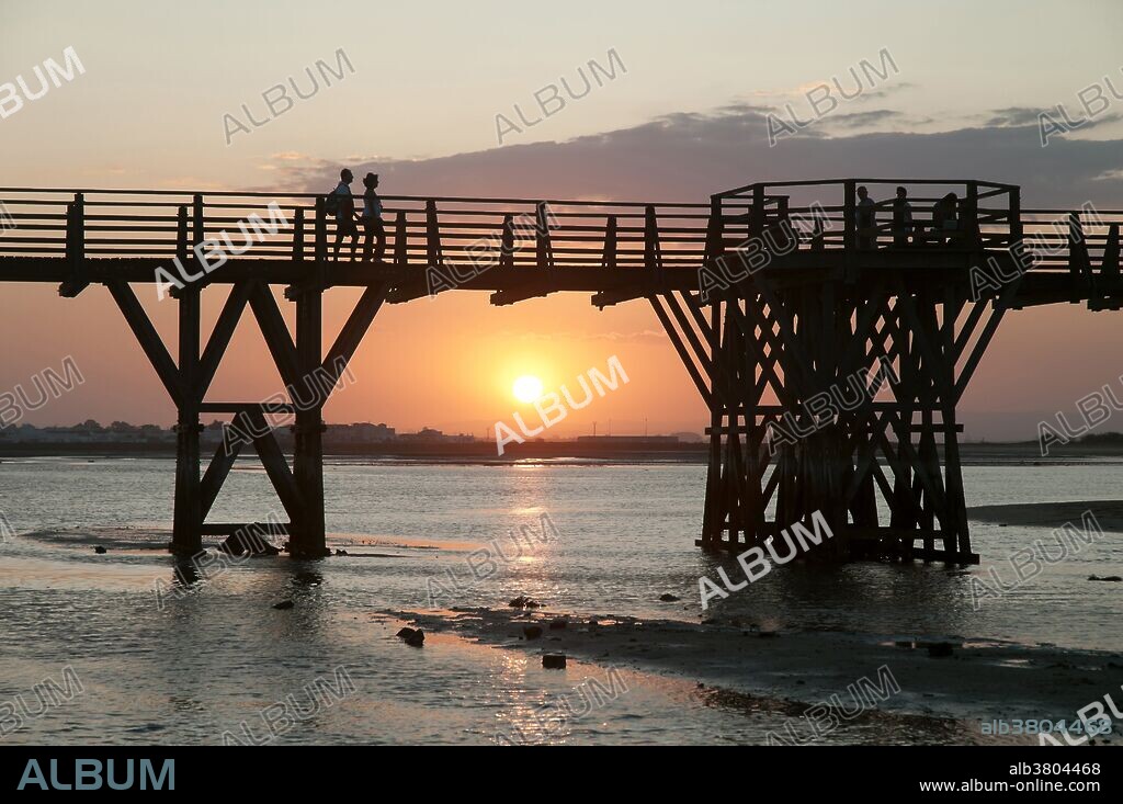 Punta del Caiman beach at sunset, Isla Cristina, Huelva province, Region of Andalusia, Spain, Europe.