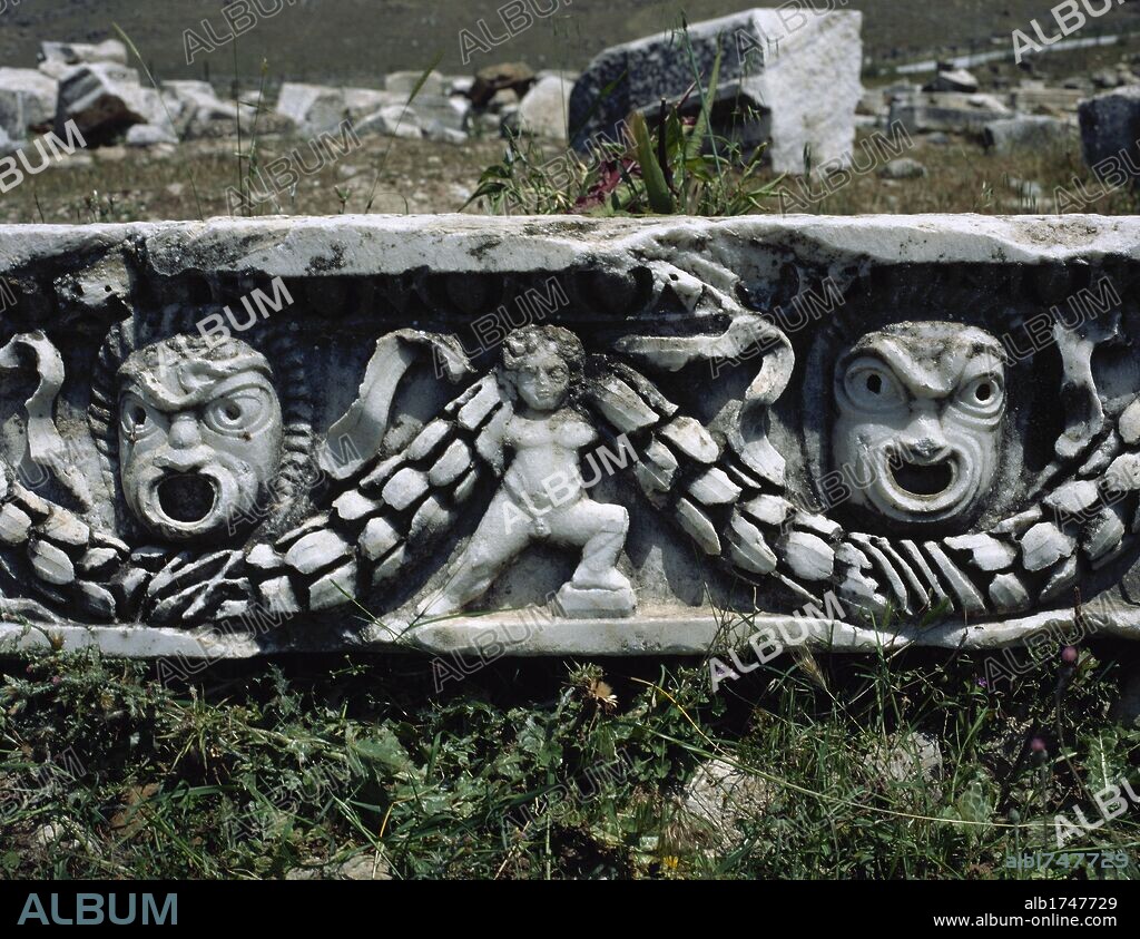 Hierapolis. Ancient city in classical Phrygia, Anatolia. Depiction of theatrical masks and cupid holding a garland. Remains of the theater frieze, built in the 2nd century. Turkey.