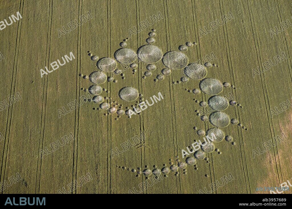 Crop circles, Stonehenge Down, Wiltshire, 1996. Some people regard crop circles as evidence of UFO contact or spiritual activity. Others believe they are hoaxes.