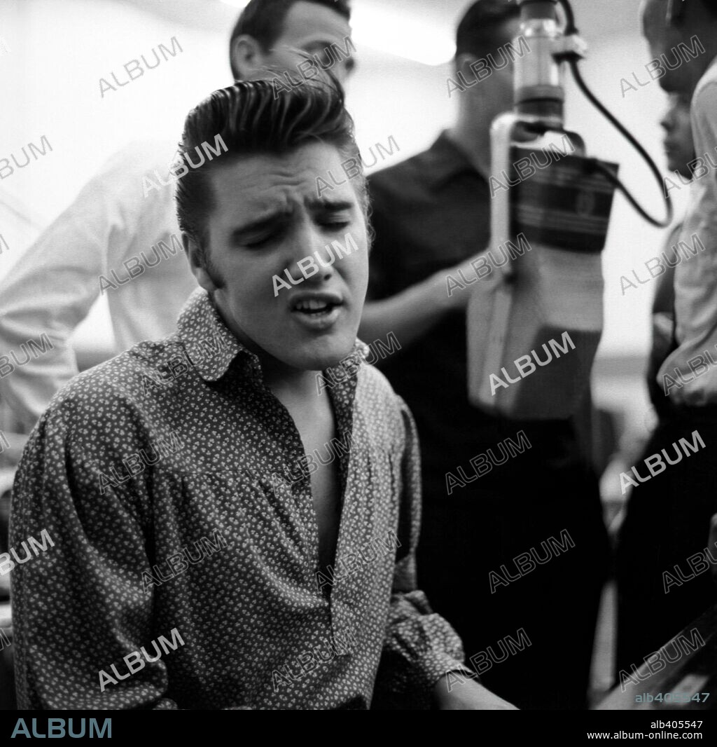 The American singer Elvis Presley during a recording session in 1956.