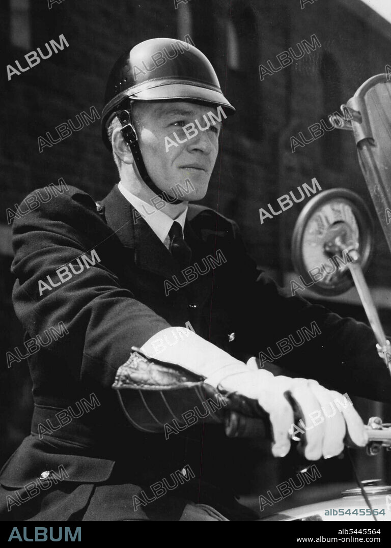 Motor-Cycle Police Test New Helmet Constable G. Crost demonstrates an American - type crash helmet which may be issued soon to all motor cycle patrolmen of the Victorian Police Force. The helmet can with-stand an impact equal to a 2000-lb. blow. If used here it would be painted white and carry the Victorian Police badge. November 1, 1955.