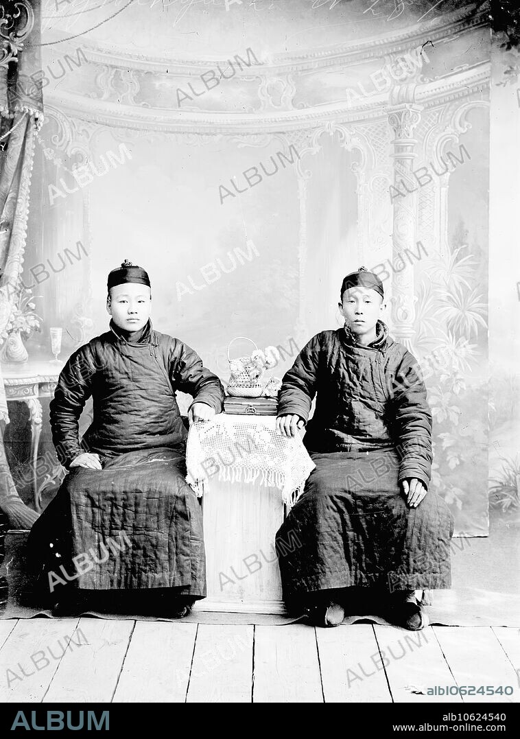 NIKOLAI NIKOLAEVICH PETROV. Two Asian men, 1900. From a collection of 71 items (photographs and negatives on glass) made in the late 19th century and early 20th century by the famous revolutionary-populist and social and political activist N.A. Charushin (1851-1937) and by N. Petrov. Charushin began serving a hard labor sentence in the Transbaikal Territory in 1878. The materials in the collection illustrate aspects of Transbaikal history in this period, with a particular emphasis on the tea trade with China, which at that time was one of the main branches of the economy of the region. The photographs show various technological processes of growing and preparing tea, sections of trade routes, as well as views of China, Mongolia, Buryatia, and various towns and villages of Transbaikal, as well as images of local people of different ethnicities and nationalities. V.A. Obruchev Museum of Kyakhta Regional History and Folklife.