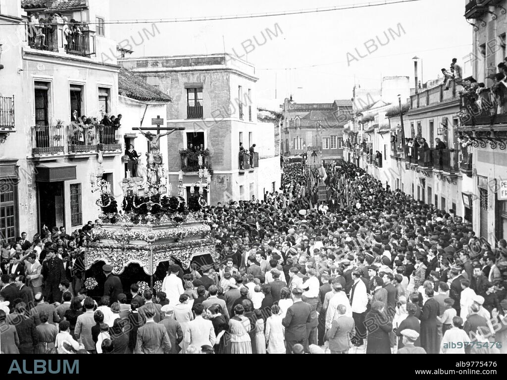 1936. Seville. The Brotherhood of San Bernardo As it passes through Ancha Street, where the Famous Cuchares el Gordo, el tato and la santera were born.
