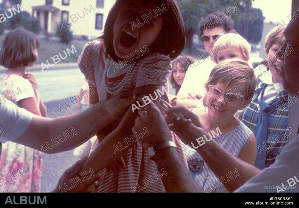 Young girl is receiving polio immunization injection at a mobile clinic. A person is considered to be fully immunized if he or she has received a primary series of at least three doses of inactivated poliovirus vaccine (IPV), live oral poliovirus (OPV), or any combination of IPV and OPV. n the early 1950's, there were more than 20,000 cases of polio each year. After polio vaccination began in 1955, cases dropped significantly. By 1960, the number of cases dropped to about 3,000, and by 1979 there were only about 10.