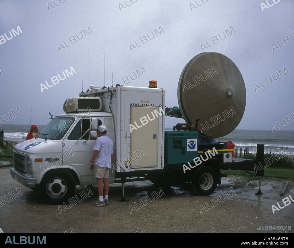 The very first Doppler on Wheels portable weather radar truck (DOW I) studies the approach of Hurricane Fran from Myrtle Beach, South Carolina.