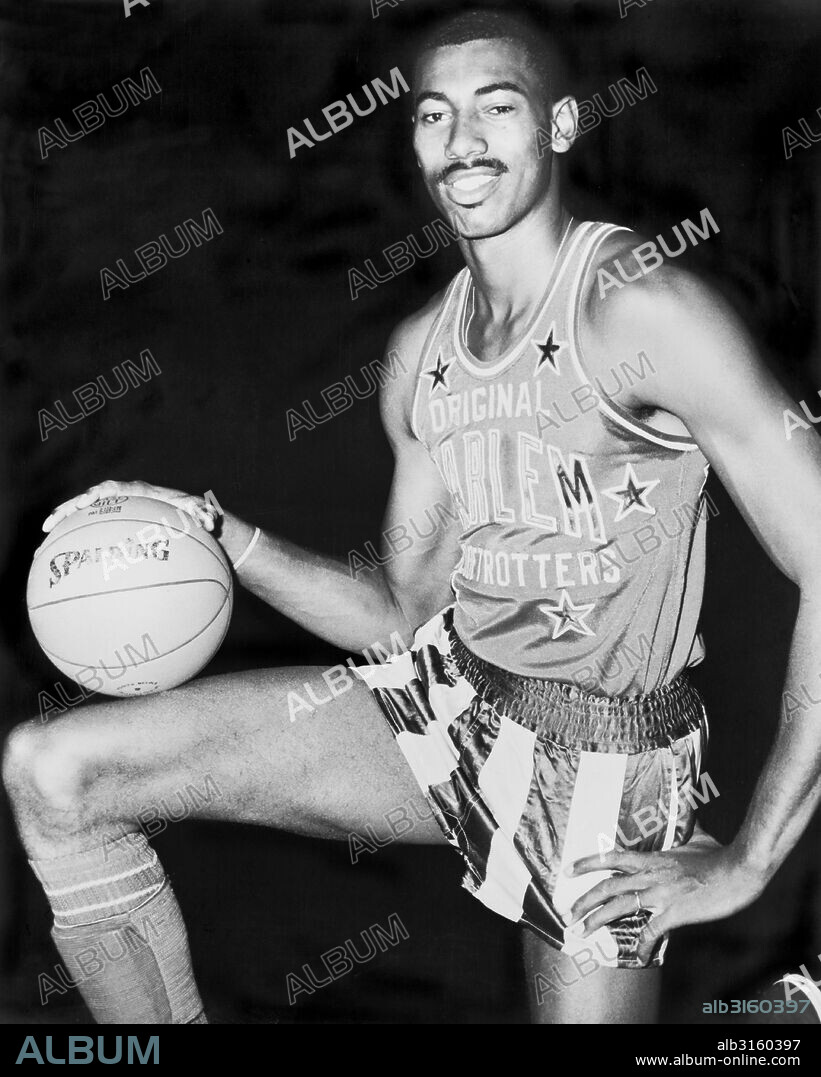 United States: 1959 All-Star basketball player Wilt Chamberlain wearing a Harlem Globetrotters uniform.