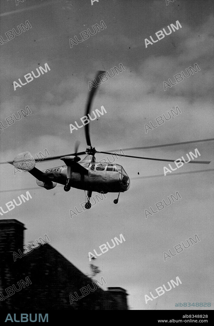 Britain Beats World's Helicopter Speed Record -- The Gyrodyne flashes past the camera at a speed of 133.1 mph - its second run over the marked course - when setting up the world's record at White Waltham Airport today. A new world helicopter speed record was established today at White Waltham airfield, near Maidenhead, by squadron Leader Basil Arkell, a rotor aircraft test pilot, in the Fairey Aviation company's prototype Gyrodyne. over four runs, his average speed was finally given as 124.3 miles per hour. The former world's official record is given as 76.7 mph made by a German FW 61 helicopter, although an unofficial record of 114.6 mph was set up by an American Sikorsky R.5 military two-seat helicopter last year. June 28, 1948. (Photo by Fox Photos).