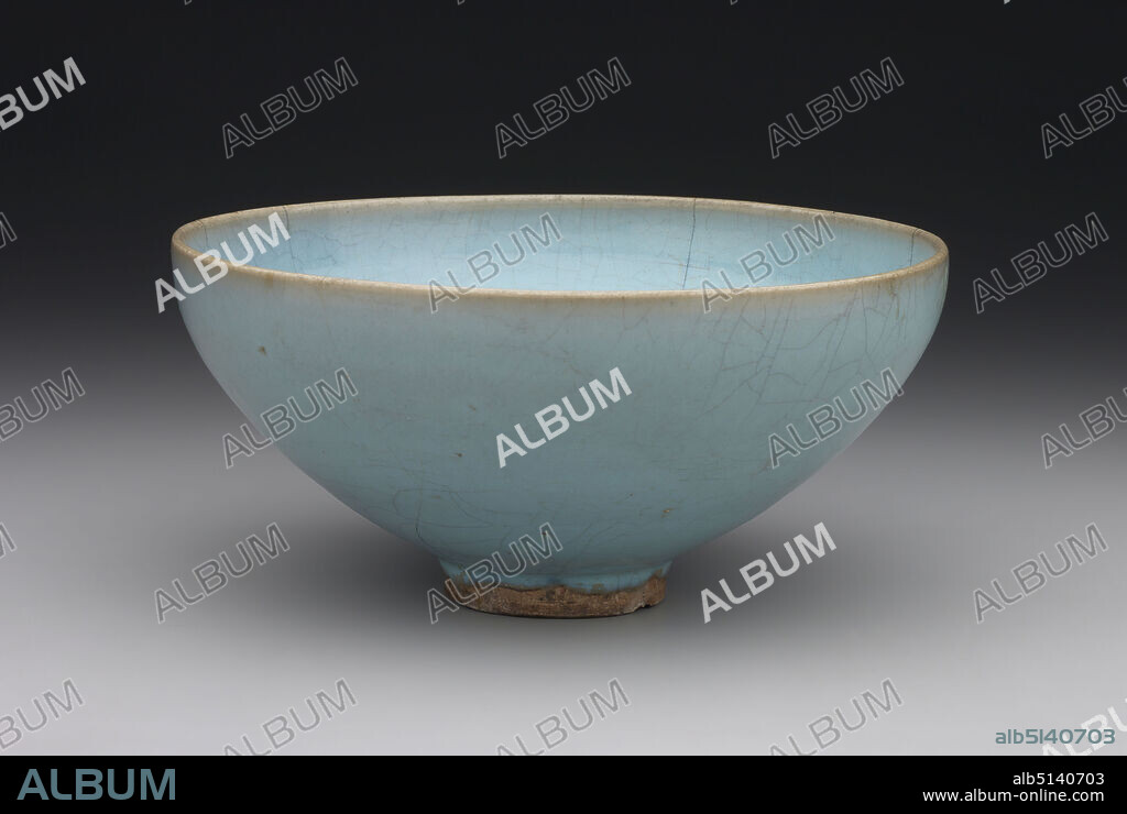 Bowl, 12th century, Stoneware with crackled blue glaze (Jun ware), 4 × 8 3/4 in. (10.2 × 22.2 cm), Jun wares, made for the court and for popular consumption, were produced at the kilns in Henan Province from the tenth to the fifteenth century. The delicate, robins-egg blue glaze covering this bowl was invented at the Henan kilns and typifies early Jun wares. The richness of the glaze is enhanced by the pattern of small cracks that fills the surface, which is known as crackle or crazing. While it remains unclear whether this effect was deliberate or caused by an accident in the kiln, it was prized at the court in the twelfth century and was often recreated in later ceramics. , China, Chinese, Northern Song dynasty (9601127) or Jin dynasty (11151234), Containers - Ceramics.