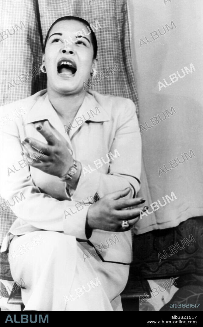 Billie Holiday (born Eleanora Fagan April 7, 1915 - July 17, 1959) was an African-American jazz singer, songwriter, and actress. Nicknamed "Lady Day" by her friend and musical partner Lester Young, she had a seminal influence on jazz and pop singing. Her vocal style, strongly inspired by jazz instrumentalists, pioneered a new way of manipulating phrasing and tempo. Her delivery made her performances recognizable throughout her career. Her improvisation compensated for lack of musical education. Her voice lacked range and was thin, and years of drug use altered its texture and gave it a fragile, raspy sound. Holiday said that she always wanted her voice to sound like an instrument and some of her influences were Louis Armstrong and singer Bessie Smith. By the 1950s, her drug abuse, drinking, and relationships with abusive men caused her health to deteriorate. By early 1959 she had cirrhosis of the liver. She was taken to Metropolitan Hospital in New York with liver and heart disease. She was arrested for drug possession as she lay dying, and her hospital room was raided. She died from pulmonary edema and heart failure caused by cirrhosis of the liver on July 17, 1959, at the age of 44. She died with $0.70 in the bank and $750 (a tabloid fee) on her person. Photographed by Carl Van Vechten March 23, 1949.