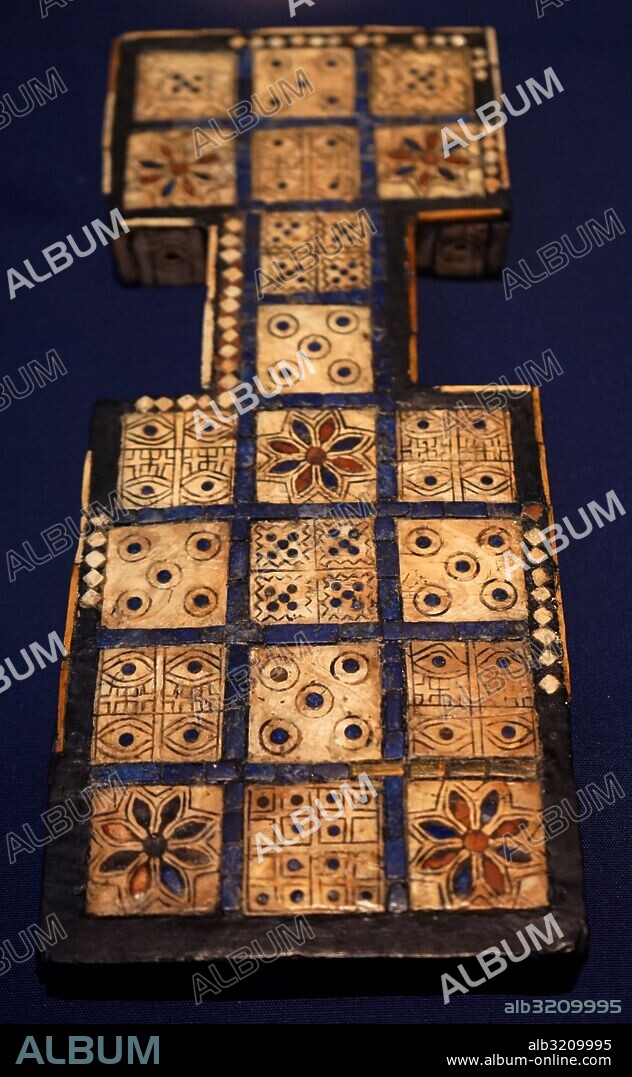 The Royal Game of Ur. also known as the Game of Twenty Squares, refers to an ancient game represented by two game boards found in the Royal Tombs of Ur in Iraq by Sir Leonard Woolley in the 1920s. Dated 2600 BC.