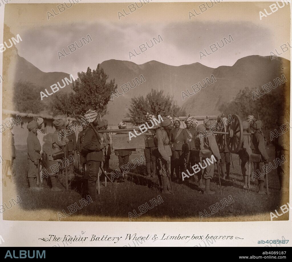 GEORGE MICHAEL JAMES GILES. The Kahar Battery Wheel and Limber box bearers. 1885. [Albumen print, 278x210mm]. Album of 'Photographs, Gilgit, Chitral, Yassin, Mastuch, &ca.' [Gilgit Mission]. The photographs are recorded as having been sent from India to the Secretary of State in August 1886., August 1886,. Source: Photo 1040/36.