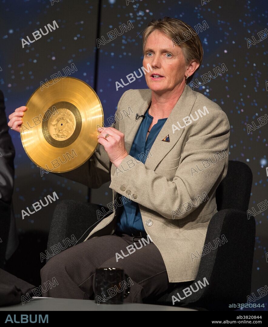 Suzanne Dodd, Voyager project manager at NASA's Jet Propulsion Lab holds a replica of the golden record carried on Voyager at a press conference at NASA Headquarters in Washington. The record was intended to communicate a story of our world to extraterrestrials. It is a gold-plated audio-visual disc carrying photos of Earth and its lifeforms, spoken greetings, and a medley of sounds found on Earth. Voyager 1 is the first human-made object to venture into interstellar space. The 36-year-old probe is about 12 billion miles (19 billion kilometers) from our sun. It is expected to continue its mission until 2025, when it's generators will no longer be able to supply enough power to operate its instruments.