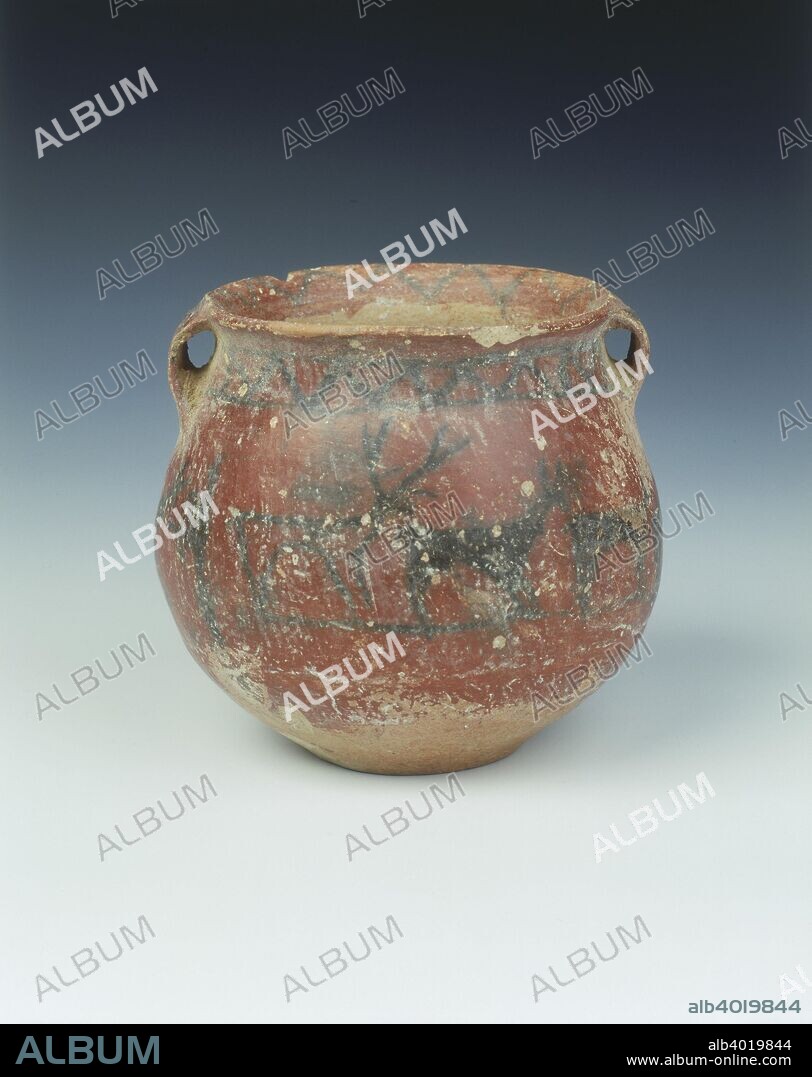 Ochre red slipped pottery jar with deer and archer, Karuo culture, China, c2300-c1800 BC. A jar with two small handles, covered with ochre red coloured slip down three quarters of the exterior and about 1.3 cm into the interior. Painted in black on handles and inside the rim with chevrons, a band of chevrons with lines round the jar under the handles. The middle of the jar has a continuous band of deer of different sizes and sexes and a man with bow and arrow all drawn in black pigment on the ochre red ground. The pottery is of brick red colour, and the base has a shallow indentation.