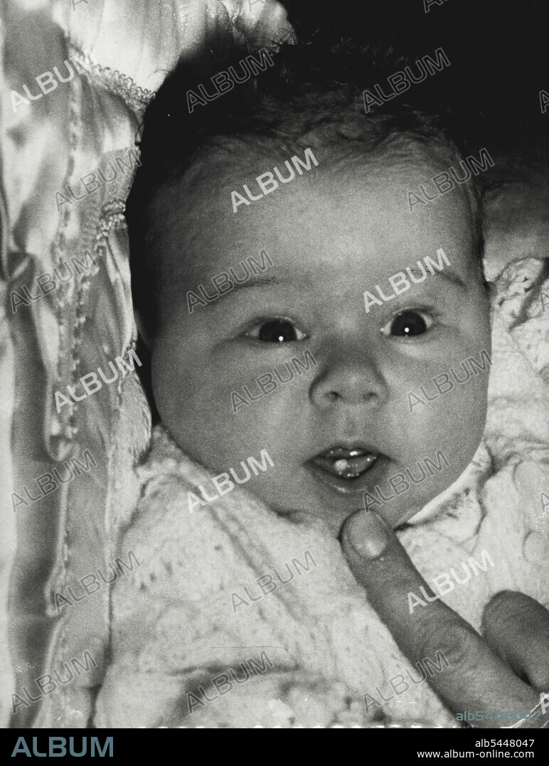Six-week-old Julie Anne Hair (above), of Central Rd., Beverley Hills, has been nick-named "Toothy" by nurses at St. Margaret's Hospital, Darlinghurst. The reason: When she was born on June 2, Julie Anne had a tooth in her lower gum. Mrs. Hair said today she did not believe the nurses when they told her of the tooth. "I wasn't game to look for myself for over a day." she added. Julie Anne smiled for a photographer today and displayed the tooth. July 12, 1954.