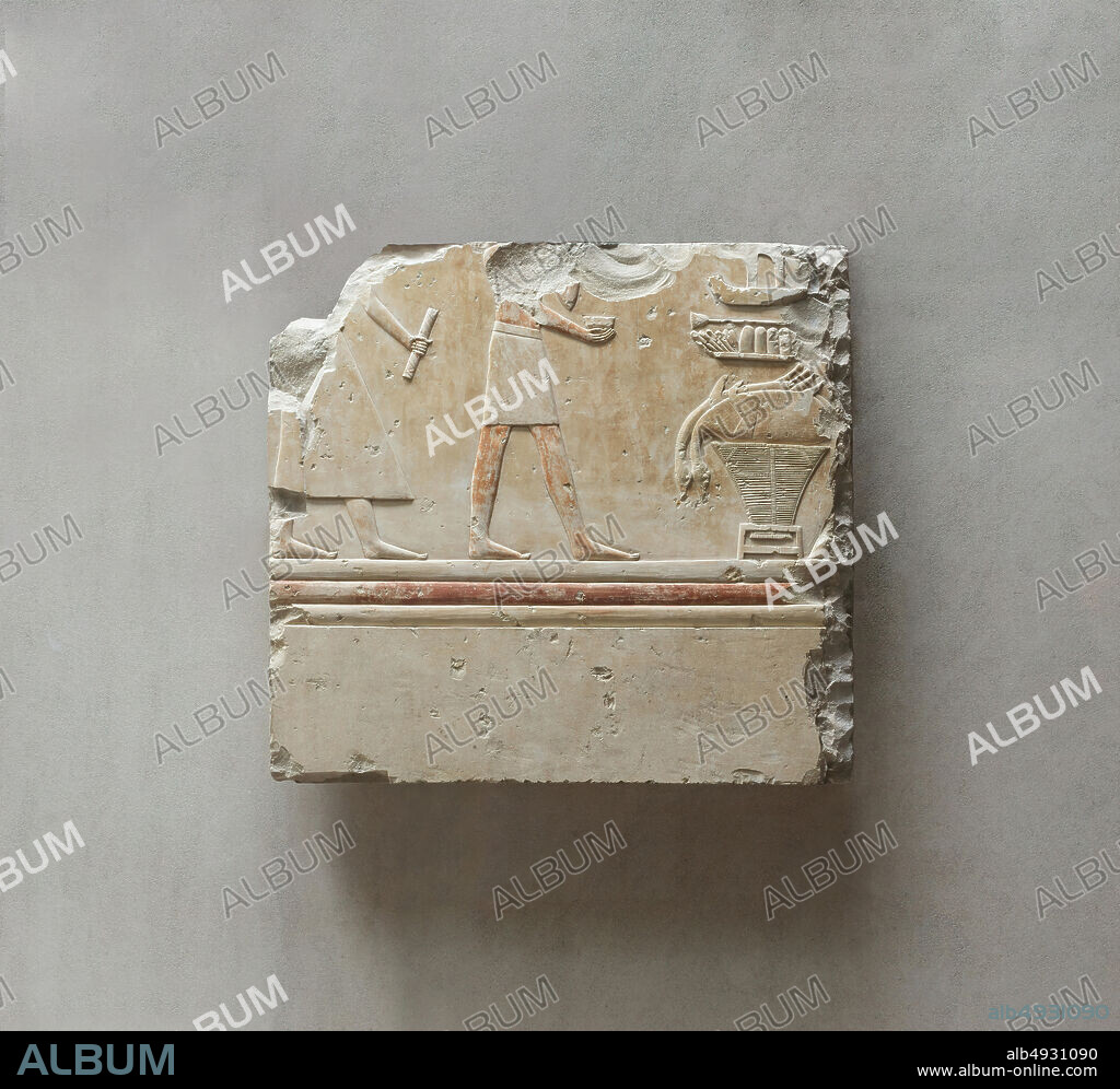 Relief from the tomb of Queen Neferu: a scribe and a cupbearer approach the queen's offering table, Middle Kingdom, Dynasty 11, reign of Mentuhotep II, early, ca. 20512030 B.C., From Egypt, Upper Egypt, Thebes, Deir el-Bahri, Tomb of Neferu, 192325, Limestone, paint, H. 51.5 x W. 55 cm (20 1/4 x 21 5/8 in.).