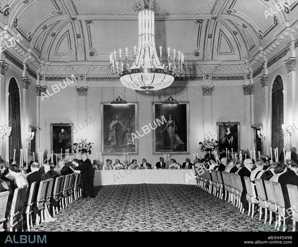 The Royal Visitors At Ottawa State Dinner -- At the end table under portraits of King George V and Queen Mary, are seen (center), Princess Elizabeth chatting to Viscount Alexander. On her right Prime Minister St, Laurent. On Viscount Alexander's left is the Duke of Edinburgh talking with Lady Alexander. Princess Elizabeth and the Duke of Edinburgh, at present on their tour of Canada, were entertained at a State Dinner by the Governor General, Field-Marshal Viscount Alexander and Lady Alexander in Ottawa. October 15, 1951. (Photo by Fox Photos).