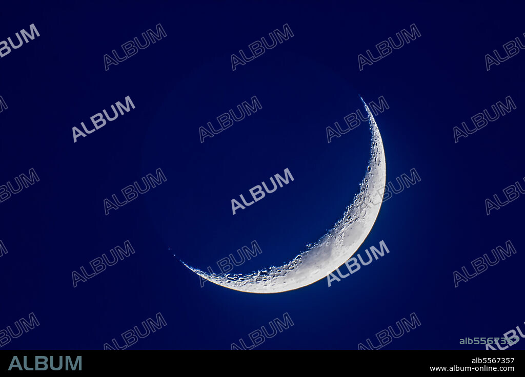 The 4-day-old waxing crescent moon on April 8, 2019 in a single exposure when the moon was still in the bright blue twilight. Even so, the faint Earthshine is just becoming visible.