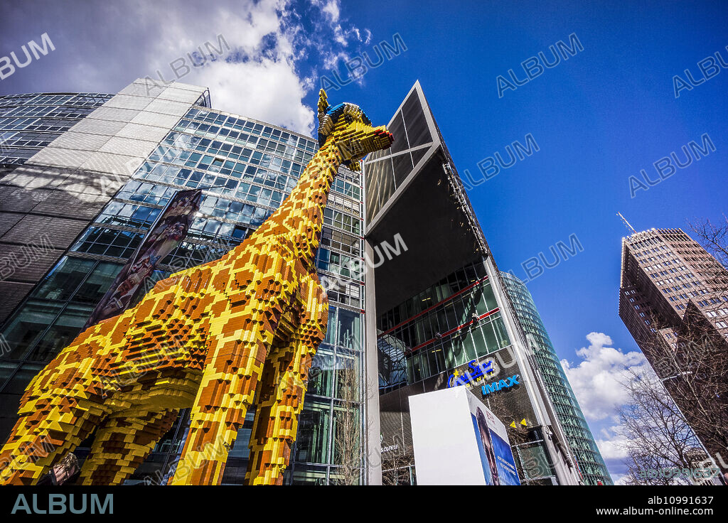giant giraffe built with Lego pieces, Potsdamer Platz buildings, Berlin, germany, europe.