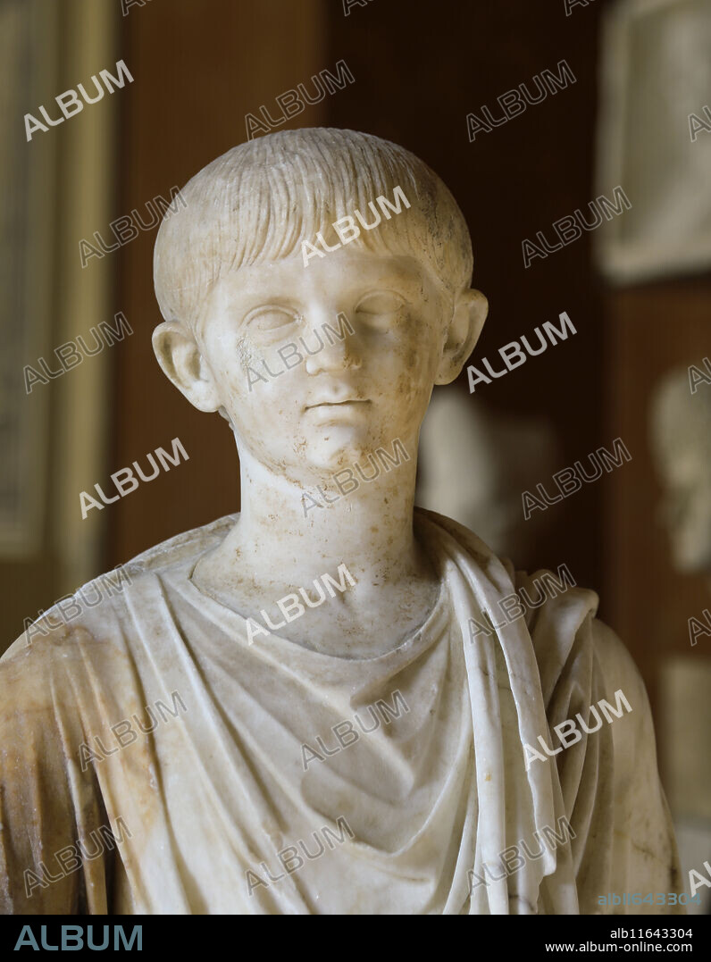 Nero (37 AD-68 AD). Roman Emperor from 54-68. Statue of infant Nero in toga, with bulla, holding a scroll. Ca. 50 AD. Marble. Louvre, Paris, France.