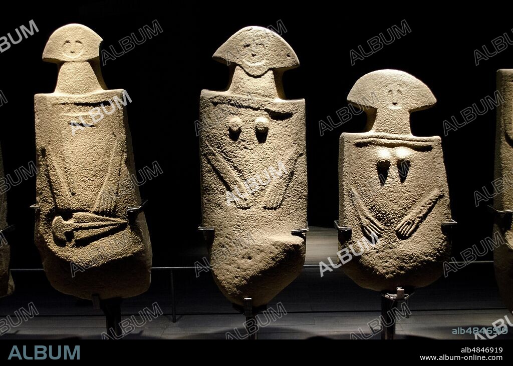 PREHISTORY three examples of a stele statue, a masculine holding an ax and a dagger, and two female ones. This type of anthropomorphic monument in sandstone is part of the phenomenon of megalithism, common to the pre / protohistoric populations of Europe between the fourth and first millennium BC - Italy, Copper Age.