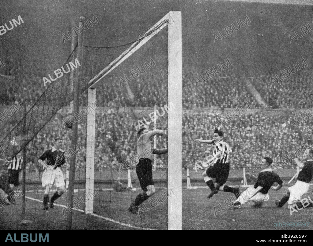 Jack Allen heads Newcastle's first goal, FA Cup Final, Wembley, London, 1932. The Arsenal players are Eddie Hapgood, goalkeeper Frank Moss, Herbie Roberts and George Male. Allen's 38th minute header cancelled out Bob John's opening goal for Arsenal. Allen scored again in the 72nd minute to win the cup for the Magpies. A print from Football Ambassador by EA (Eddie) Hapgood, Sporting Handbooks LTD, London, 1945.