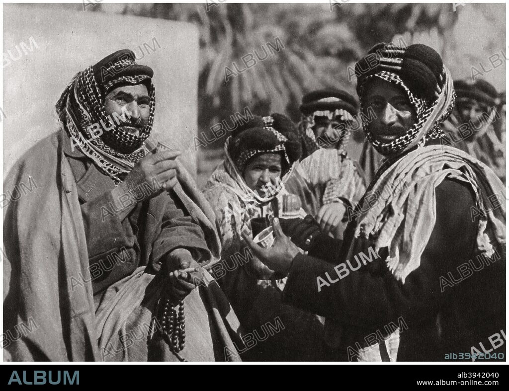'A sheikh enjoying the famous Arab coffee', Iraq, 1925. A print from Baghdad, Camera Studio Iraq, published by Hasso Bros, Rotophot AG, Berlin, 1925.