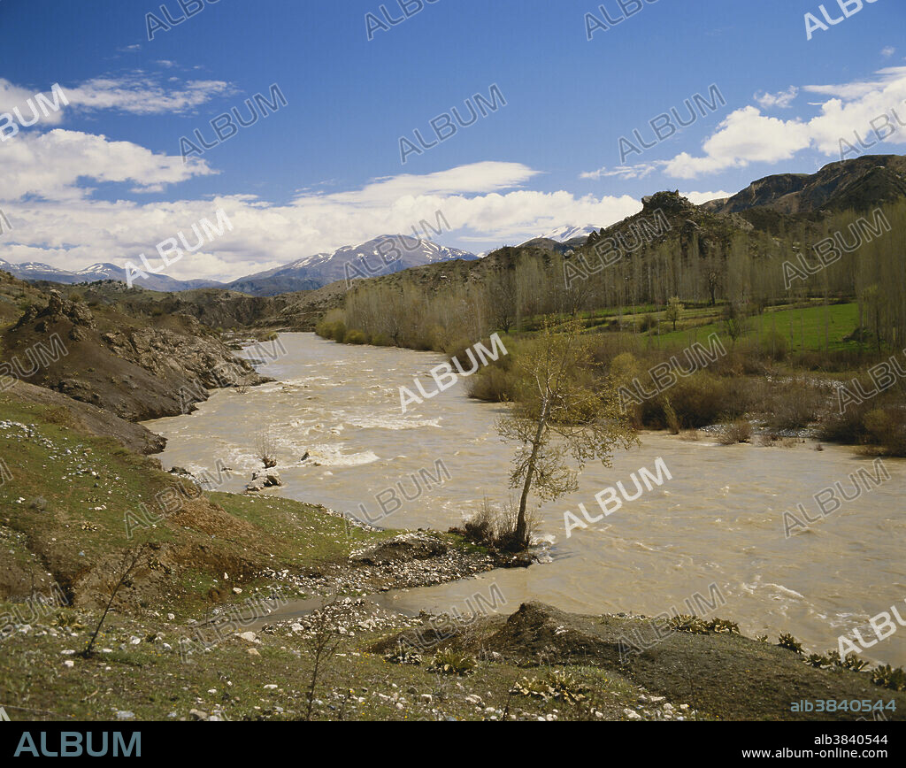 A river flowing with thawing spring meltwater near Golbasi in the Adiyaman district of Turkey, near the source of the Euphrates River.