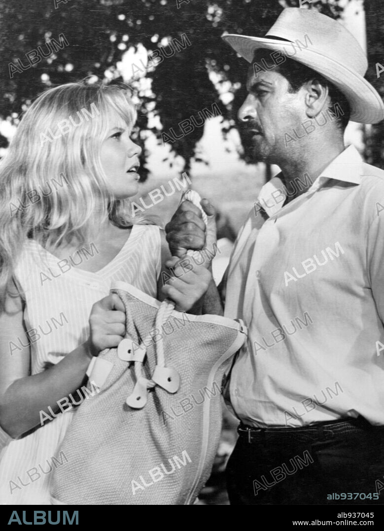 ELI WALLACH and HAYLEY MILLS in THE MOON-SPINNERS, 1964, directed by JAMES NEILSON. Copyright WALT DISNEY PICTURES.