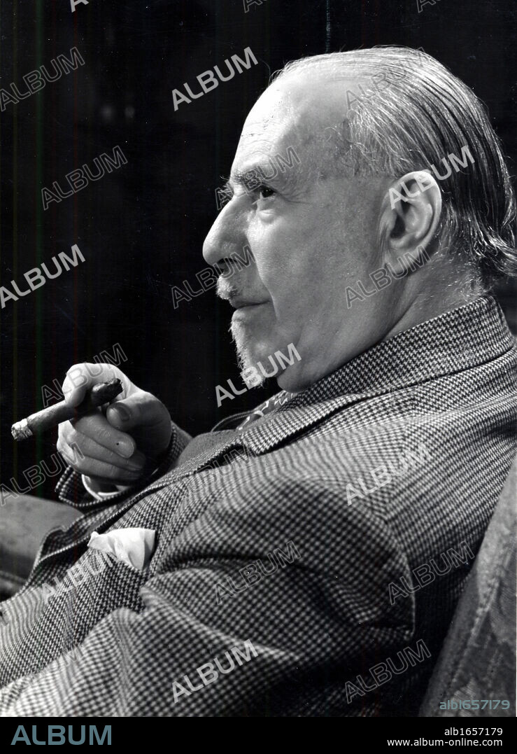 Thomas Beecham (1879-1961) English conductor and impresario. Beecham holding a cigar. Photograph by courtesy of EMI.