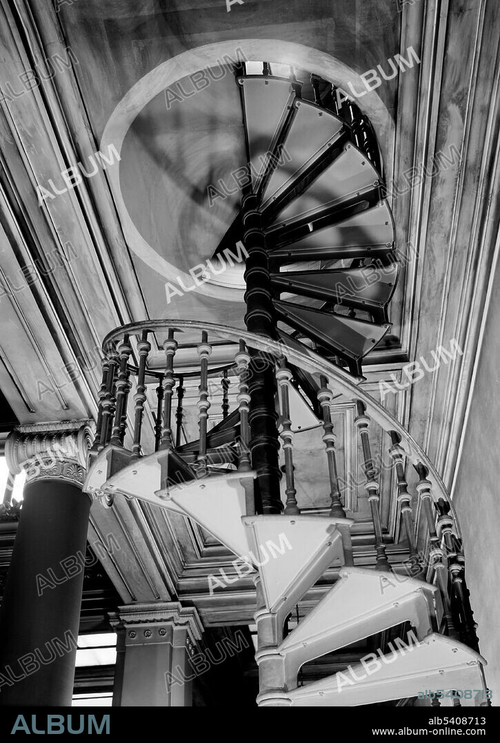 Spiral staircase to attic. Library Company of Philadelphia,  Philadelphia, PA. Spiral stairs wind around a newel (central pole). They typically have a handrail on the outer side only, on the inner side just the central pole, and are often very steep. A pure spiral assumes a circular stairwell and the steps and handrail are equal and positioned screw-symmetrically. A tight spiral stair with a central pole is very space efficient in the use of floor area. A squared spiral stair assumes a square stairwell and expands the steps and railing to a square, resulting in unequal steps. Historic American Buildings Survey, undated (cropped and cleaned).