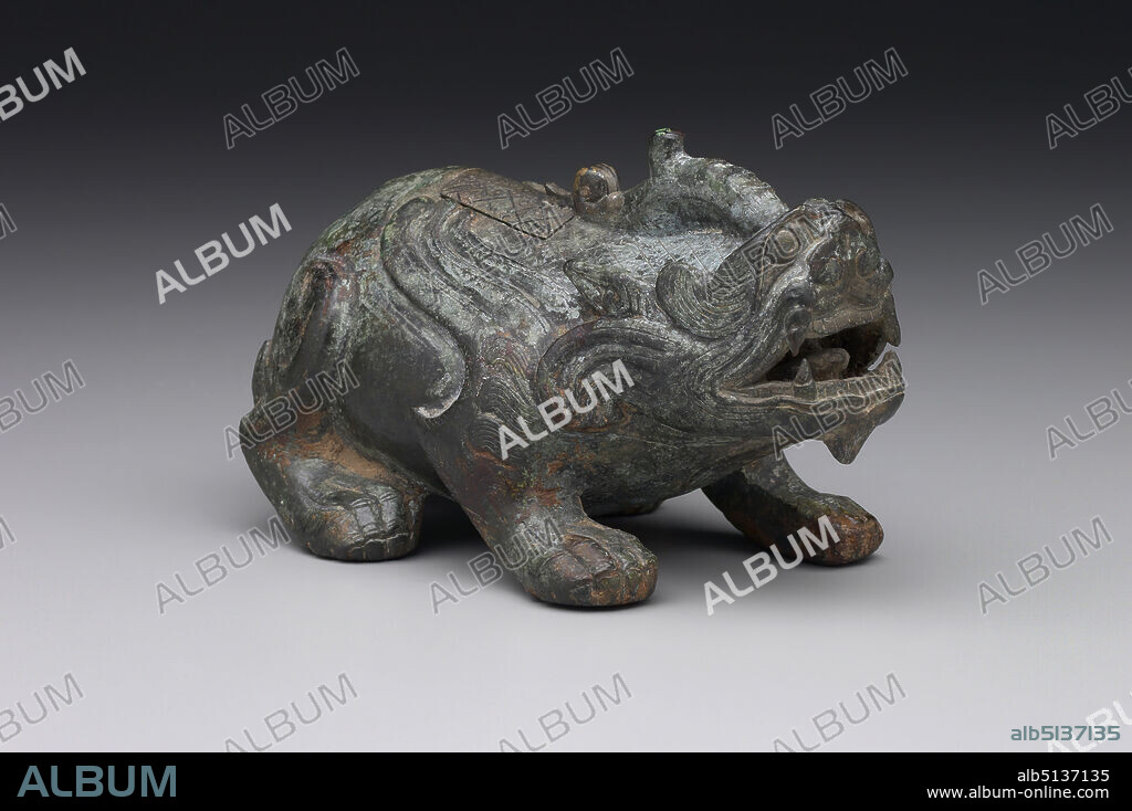 Lamp in the Shape of the Mythical Tianlu, 1st century B.C.E.1st century C.E., Bronze, 2 7/8 × 5 1/8 × 2 3/4 in. (7.3 × 13.02 × 6.99 cm), Identified by its single horn, the tianlu is one of two chimeralike beasts that were believed to be protective and auspicious and became popular in Chinese art and literature during the Han dynasty. A small cover on the back of this vessel opens, suggesting that this charming bronze may have been used as an oil lamp. , China, Chinese, Western Han dynasty (206 B.C.E.8 C.E.), Containers - Metals.