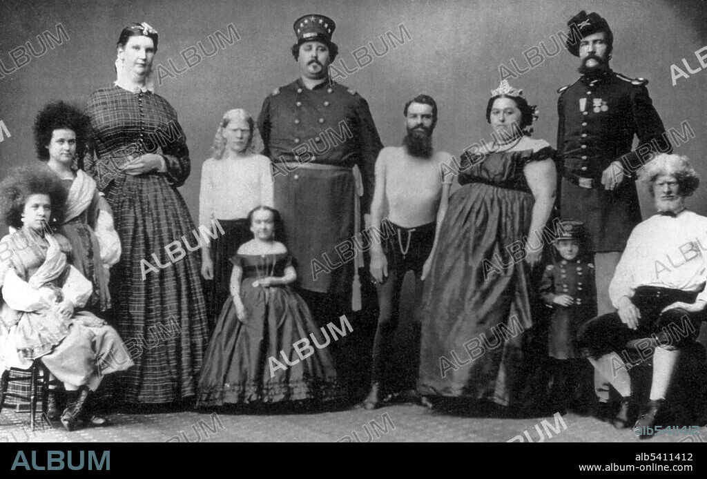Phineas Taylor (P. T.) Barnum (July 5, 1810 - April 7, 1891) was an American showman and businessman. In 1841, he opened Barnum's American Museum with a changing series of live acts and curiosities. In this undated photo are two albinos, three giants, two little people, and two “circassian beauties” women from the Northern Caucasus. The beauties have the blown-out hair. In the 19th century, women from this part of the world were believed to be unusually attractive and widely desired for Middle Eastern harems. Reportedly Barnum claimed that these two had escaped a Turkish harem. No photographer credited, undated.