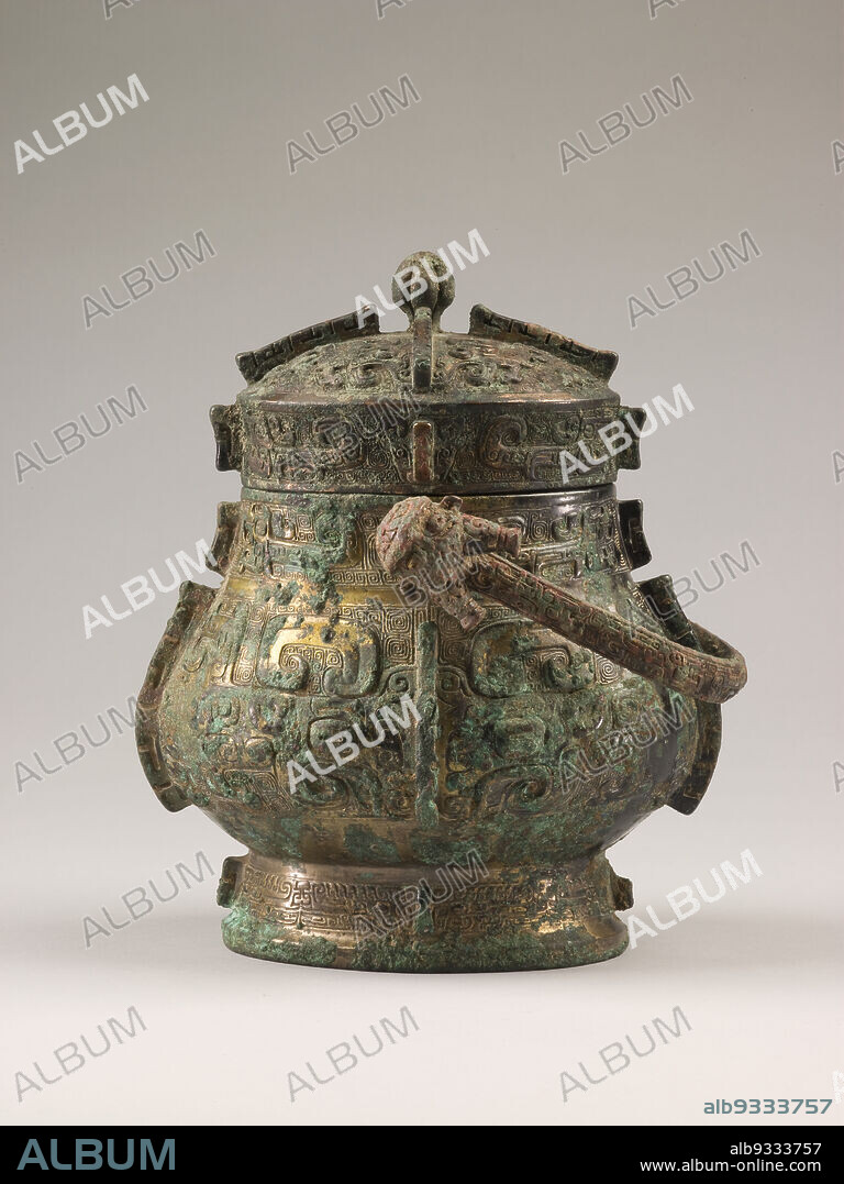 Covered Wine Vessel (you) with Swing Handle and Design of Zoomorphic Masks, Kui-Dragons, and Spiral Patterns, Chinese, Shang dynasty, 16001050 BC, 12th century BC, Bronze, China, Asia, Containers, metalwork, height with handle raised: 8 1/4 in. (20.9 cm).