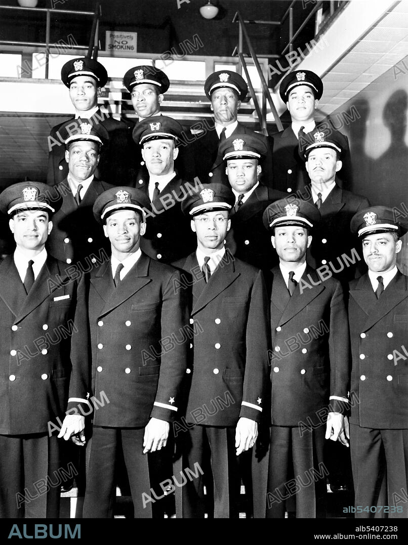 The Golden Thirteen, first African-American US Navy Officers of the US Navy Reserve (USNR). They are (bottom row, left to right): ENS James E. Hare; ENS Samuel E. Barnes; ENS George C. Cooper; ENS William S. White; ENS Dennis D. Nelson; (middle row, left to right): ENS Graham E. Martin; Warrant Officer Charles B. Lear; ENS Phillip G. Barnes; ENS Reginald E. Goodwin; (top row, left to right): ENS John W. Reagan; ENS Jesse W. Arbor; ENS Dalton L. Baugh; ENS Frank E. Sublett. March 17, 1944 (cropped and cleaned).