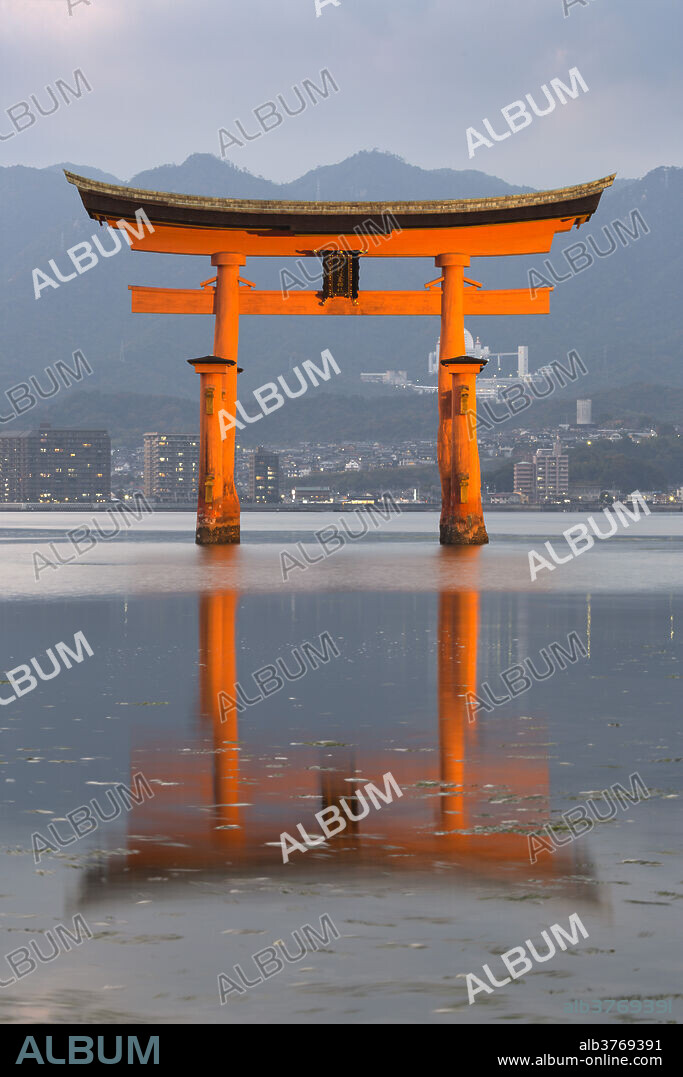 The floating Miyajima torii gate of Itsukushima Shrine at dusk, UNESCO World Heritage Site, Miyajima Island, Western Honshu, Japan, Asia.