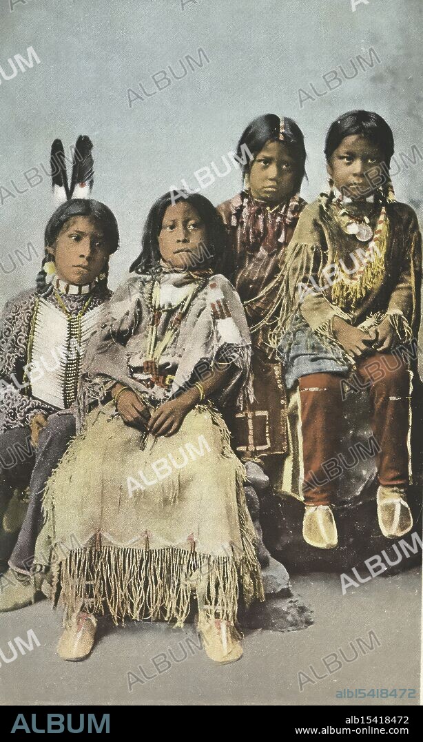 Ute Children, Indian, 1898 - 1931, Date Issued: 1898 - 1931, Place: Detroit, Publisher: Detroit Publishing Company, Date Issued: 1900 - 1902, Boys, Girls, Children, Clothing & dress, Indians of North America, Ute Indians, Offset photomechanical prints, Childhood's vibrant hue, Laughing eyes, bright feathers sway, Joy in every step.