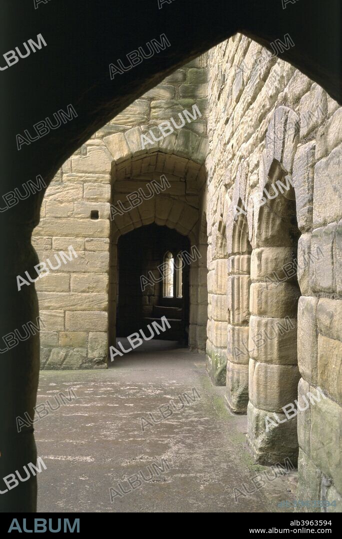 Warkworth Castle, Northumberland, 1994. A castle was probably built at Warkworth in the 12th century. The great Keep dates from the early 15th century, though it was later restored and refaced. This view shows the interior of the great hall on the first floor, with an anteroom beyond.
